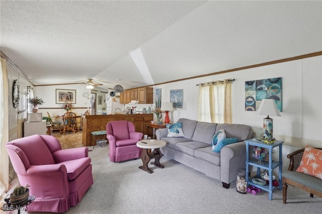 184 Garfield Ln, Jefferson, OH 44047 - living area with a textured ceiling, ceiling fan, crown molding, vaulted ceiling, and light carpet