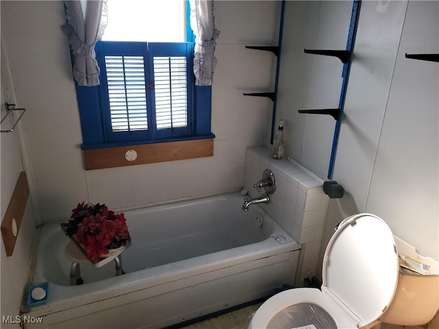full bathroom with a bath and toilet