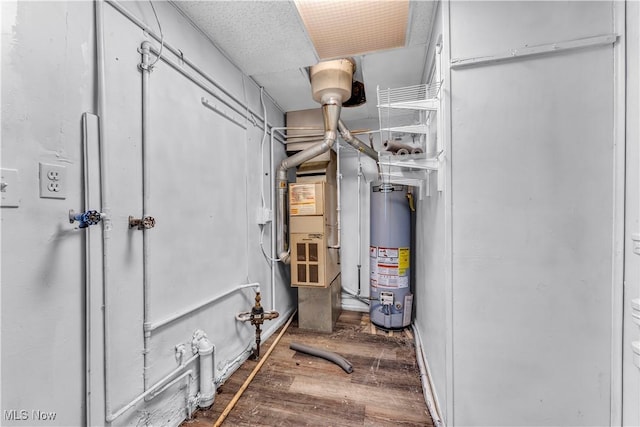utility room featuring water heater