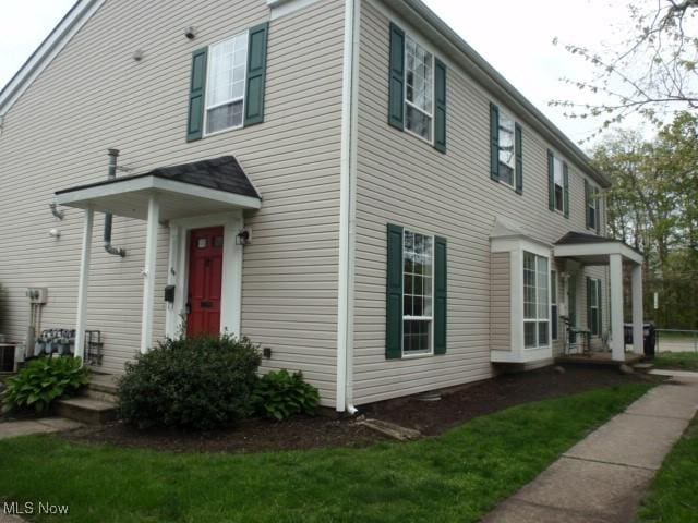view of front of house featuring cooling unit