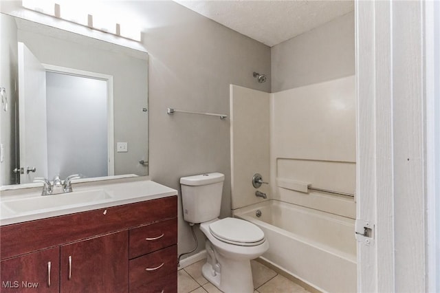 bathroom featuring toilet, tile patterned floors, vanity, and bathtub / shower combination