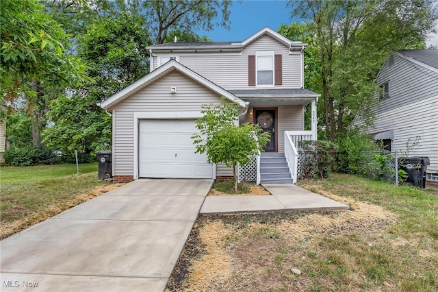 traditional-style home featuring covered porch, concrete driveway, an attached garage, and a front lawn