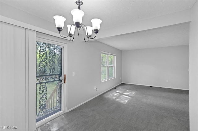 interior space with a chandelier and baseboards