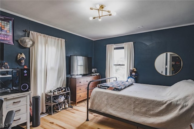 2007 Carson St, Charleston, WV 25302 - bedroom featuring ornamental molding, an inviting chandelier, and wood finished floors