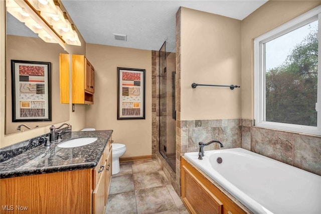 full bath featuring a garden tub, vanity, toilet, a stall shower, and baseboards