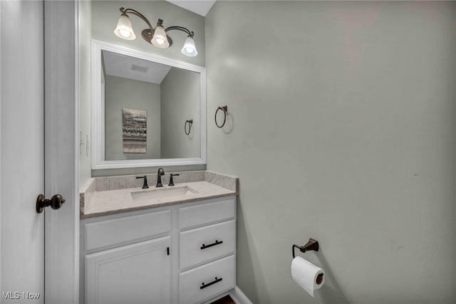 bathroom with vanity and visible vents