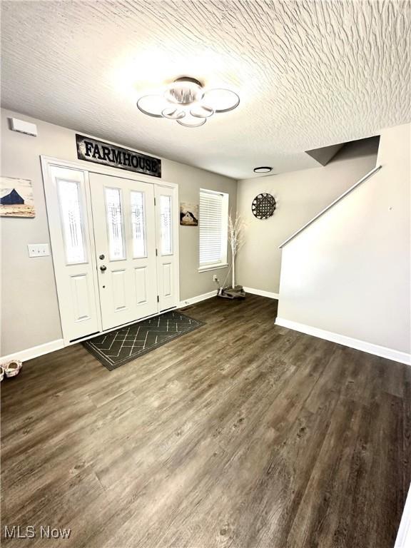 11149 Rankin Rd, Glenford, OH 43739 - entryway with baseboards, dark wood-type flooring, and a textured ceiling