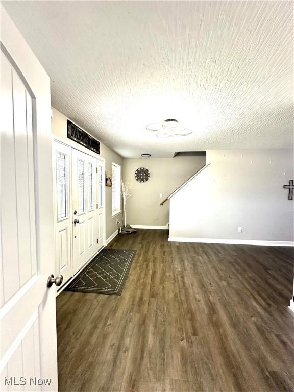 11149 Rankin Rd, Glenford, OH 43739 - entryway with wood finished floors, baseboards, and a textured ceiling
