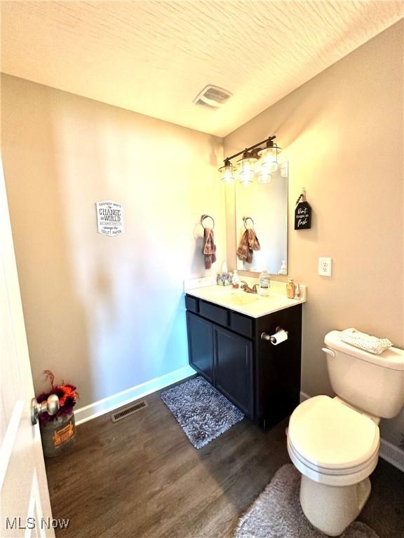 11149 Rankin Rd, Glenford, OH 43739 - bathroom with wood finished floors, vanity, toilet, and baseboards