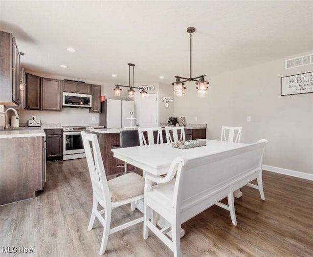 11149 Rankin Rd, Glenford, OH 43739 - dining space with light wood finished floors, baseboards, and recessed lighting