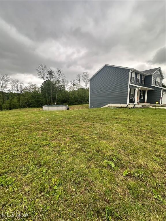11149 Rankin Rd, Glenford, OH 43739 - view of green lawn featuring a swimming pool