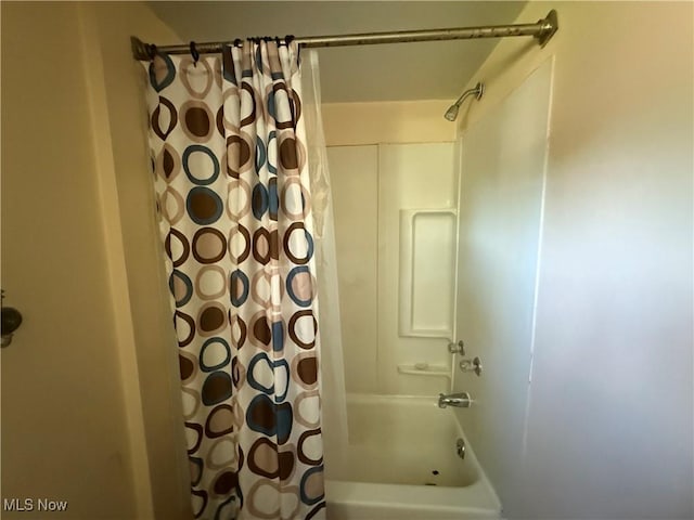 bathroom featuring shower / bath combination with curtain