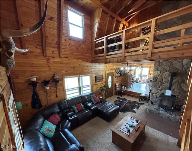 165 Township Rd Unit 1461, Greenwich, OH 44805 - living room with tile patterned flooring, wood walls, high vaulted ceiling, beamed ceiling, and a wood stove