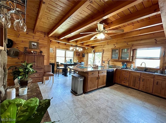 165 Township Rd Unit 1461, Greenwich, OH 44805 - kitchen featuring brown cabinets, wooden walls, a peninsula, and a sink