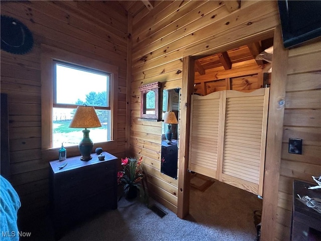 165 Township Rd Unit 1461, Greenwich, OH 44805 - bedroom with carpet flooring, wooden walls, and visible vents