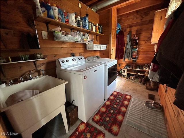 165 Township Rd Unit 1461, Greenwich, OH 44805 - washroom featuring laundry area, washer and clothes dryer, wooden walls, and a sink