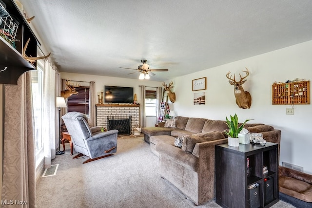 396 2nd St NE, Carrollton, OH 44615 - carpeted living area with a fireplace and a ceiling fan
