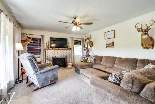 396 2nd St NE, Carrollton, OH 44615 - living area with a brick fireplace, ceiling fan, and carpet