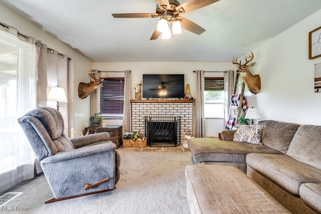 396 2nd St NE, Carrollton, OH 44615 - living room with carpet, a fireplace, and a ceiling fan