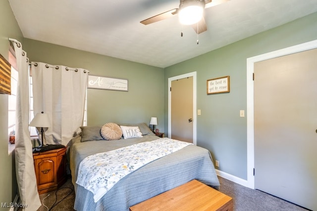 396 2nd St NE, Carrollton, OH 44615 - carpeted bedroom featuring baseboards and a ceiling fan