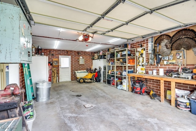 396 2nd St NE, Carrollton, OH 44615 - garage featuring a garage door opener and a workshop area