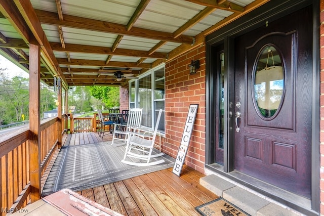 396 2nd St NE, Carrollton, OH 44615 - property entrance featuring covered porch and brick siding