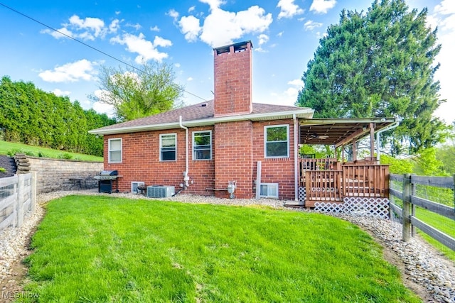 396 2nd St NE, Carrollton, OH 44615 - rear view of house featuring a chimney, central AC unit, and brick siding