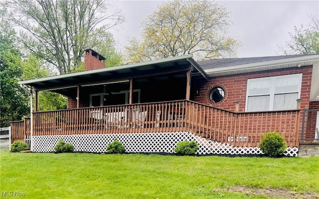 396 2nd St NE, Carrollton, OH 44615 - ranch-style house featuring a front yard, a chimney, brick siding, and a porch