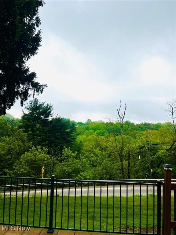 396 2nd St NE, Carrollton, OH 44615 - view of yard featuring a wooded view