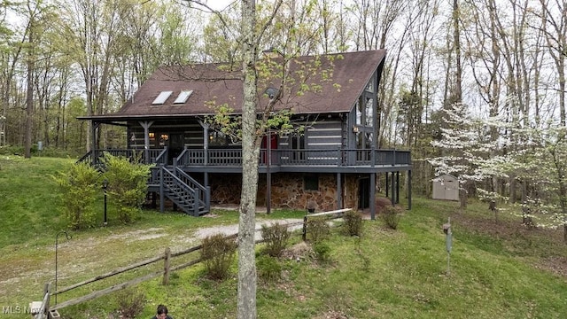 6570 State Route 339, Vincent, OH 45784 - view of front of home featuring an outdoor structure, fence, a storage unit, stairway, and a shingled roof