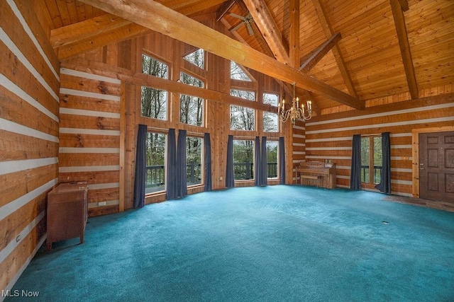 6570 State Route 339, Vincent, OH 45784 - unfurnished living room featuring wooden ceiling, an inviting chandelier, wooden walls, high vaulted ceiling, and beam ceiling