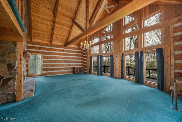 6570 State Route 339, Vincent, OH 45784 - unfurnished living room with carpet, wood ceiling, beam ceiling, and a towering ceiling
