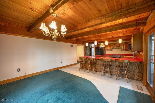 6570 State Route 339, Vincent, OH 45784 - dining space featuring baseboards, beamed ceiling, indoor bar, and wood ceiling