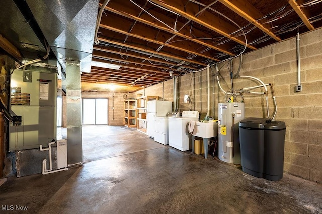6570 State Route 339, Vincent, OH 45784 - basement with a sink, freestanding refrigerator, electric water heater, heating unit, and washing machine and dryer