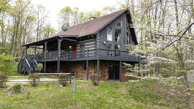 6570 State Route 339, Vincent, OH 45784 - rear view of property with a yard, stone siding, a wooden deck, and a chimney