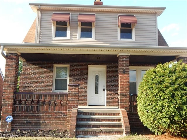 view of front of home with brick siding