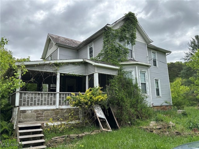212 Rost Rd, Walker, WV 26180 - back of house with a porch