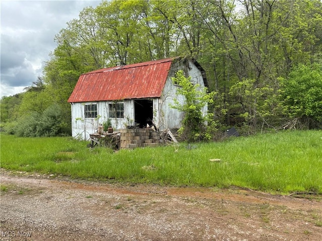 212 Rost Rd, Walker, WV 26180 - view of shed featuring a wooded view