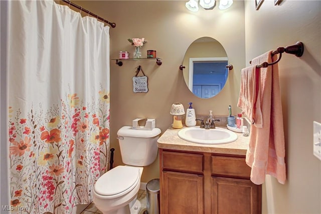 bathroom featuring toilet, vanity, tile patterned floors, and a shower with shower curtain