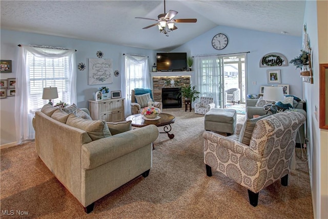 living area featuring light carpet, healthy amount of natural light, a ceiling fan, vaulted ceiling, and a textured ceiling