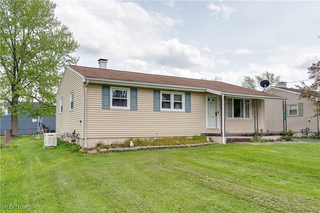single story home featuring a front yard and a chimney