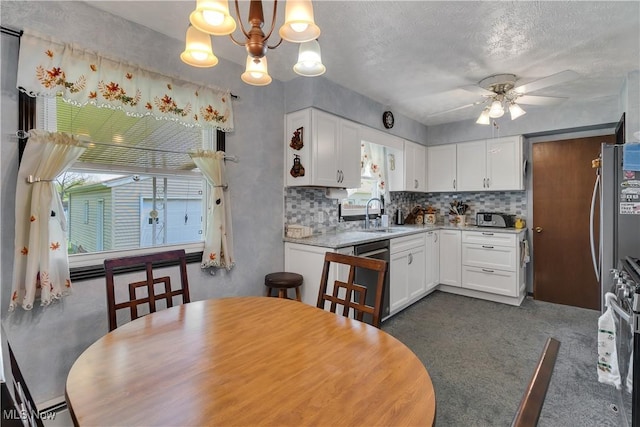dining area with a ceiling fan and a chandelier