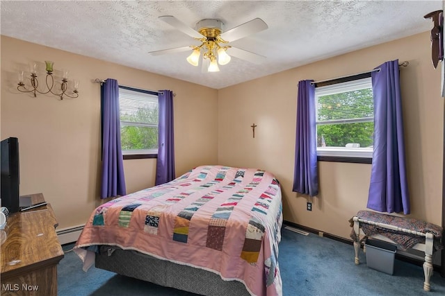 bedroom featuring carpet flooring, ceiling fan, a textured ceiling, baseboards, and a baseboard radiator