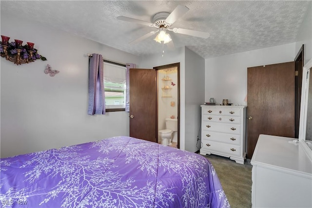 bedroom featuring dark carpet, a textured ceiling, a ceiling fan, and connected bathroom