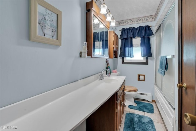 full bath featuring a baseboard heating unit, toilet, vanity, tile patterned flooring, and shower / bath combination with glass door