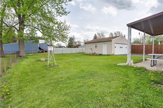 view of yard with an outbuilding and a detached garage