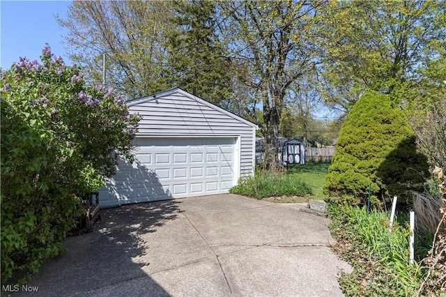 8295 Mentorwood Dr, Mentor, OH 44060 - detached garage featuring a storage shed