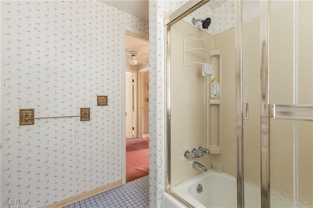 8295 Mentorwood Dr, Mentor, OH 44060 - full bathroom featuring wallpapered walls, tile patterned flooring, and combined bath / shower with glass door