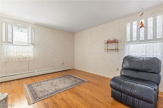 8295 Mentorwood Dr, Mentor, OH 44060 - sitting room with baseboard heating and wood finished floors