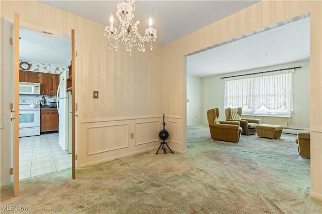 8295 Mentorwood Dr, Mentor, OH 44060 - living area featuring a chandelier, carpet, and a baseboard radiator